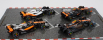 Bburago Mclaren F1  Set 4x - Team Mclaren Mcl36 N 4 Abu Dhabi Gp 2022 - Mcl60 N 4 Singapore Gp - Monaco Gp - British Gp 2023 Lando Norris 1:43 Oranžová Černá Bílá