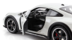 Minichamps Porsche 911 992 Dakar Coupe 2022 1:18 Světle Šedá