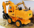 Re-el toys Case-ih Titan Escavatore Gommato - Tractor Excavator 1999 1:24 Žlutá Černá
