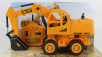 Re-el toys Case-ih Titan Escavatore Gommato - Tractor Excavator 1999 1:24 Žlutá Černá
