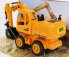 Re-el toys Case-ih Titan Escavatore Gommato - Tractor Excavator 1999 1:24 Žlutá Černá