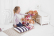Bigjigs Toys Růžový kabátek s knoflíky pro panenku 28 cm
