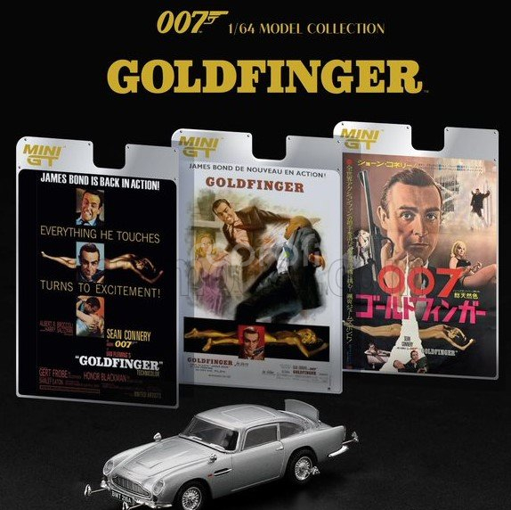 Mini-gt Aston martin Db5 1964 - 007 James Bond - Goldfinger - Missione Goldfinger With Weapons - Included Poster 007 English Language 1:64 Silver